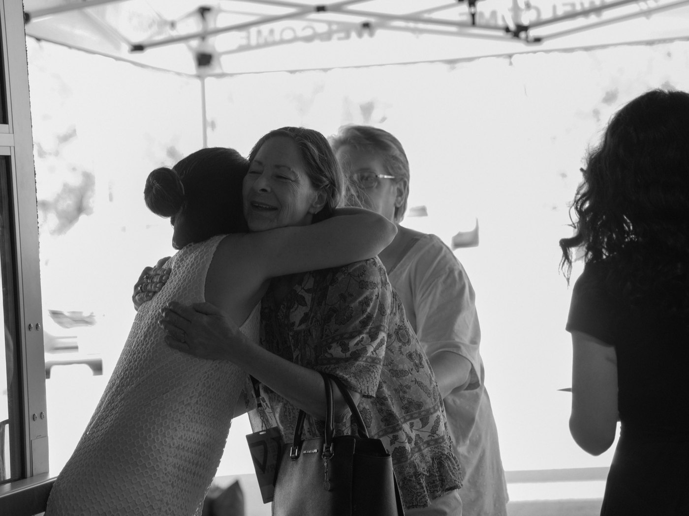 A guest being welcomed with a hug at Valor Church